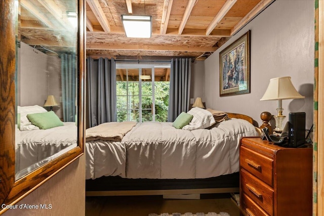 bedroom with beam ceiling and wooden ceiling