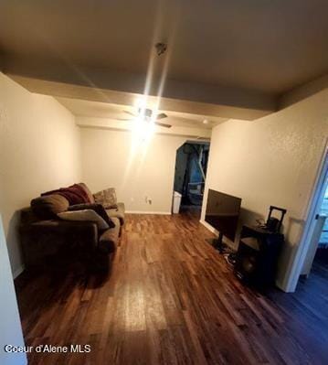 living room featuring ceiling fan and wood-type flooring