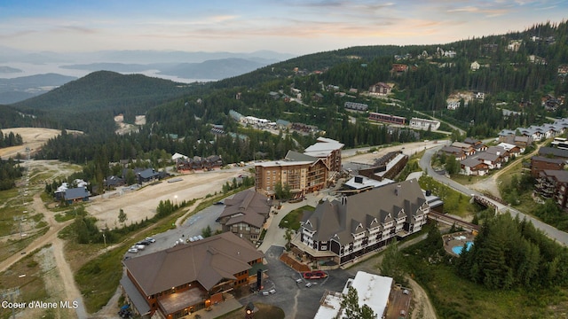 aerial view at dusk featuring a mountain view