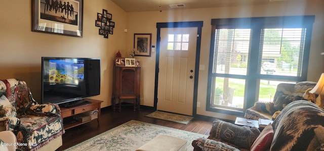 foyer with dark hardwood / wood-style floors