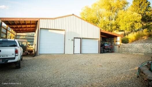 garage featuring a carport