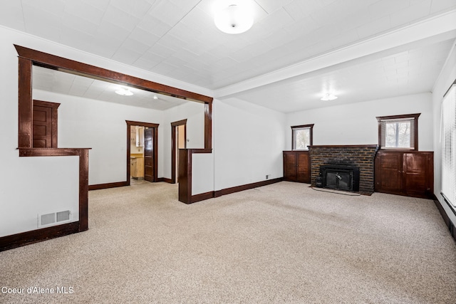 unfurnished living room with light colored carpet and a brick fireplace