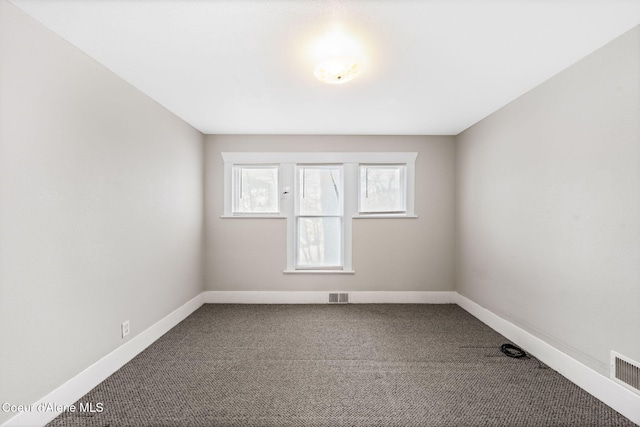 unfurnished room featuring carpet floors