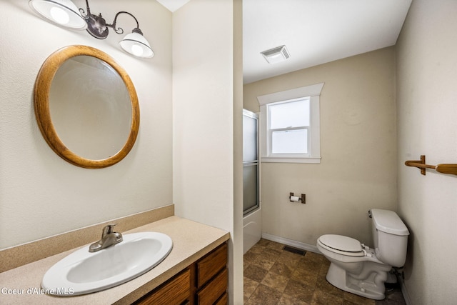 full bathroom with vanity, toilet, and enclosed tub / shower combo