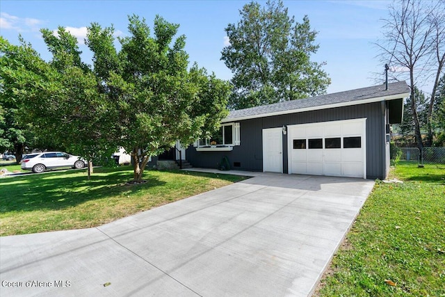 view of front facade with a garage and a front yard