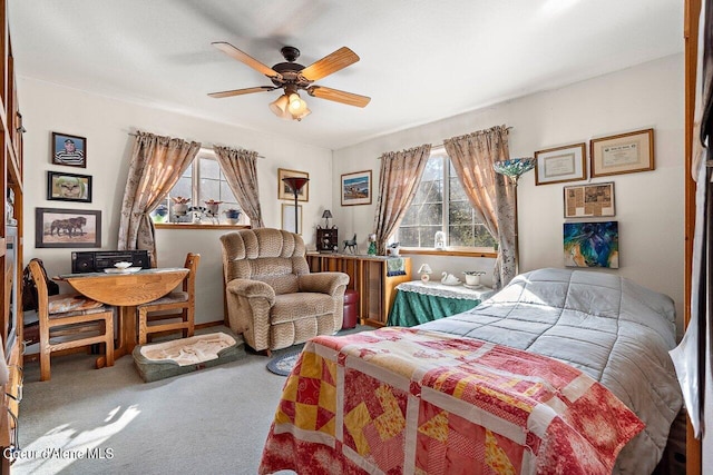 bedroom with ceiling fan and carpet flooring