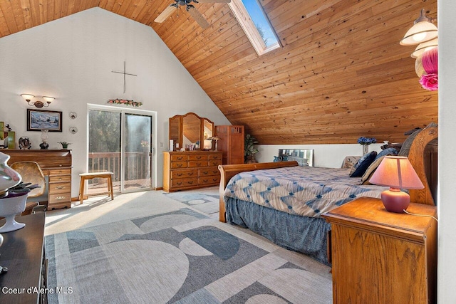 bedroom with ceiling fan, wood ceiling, a skylight, and light carpet