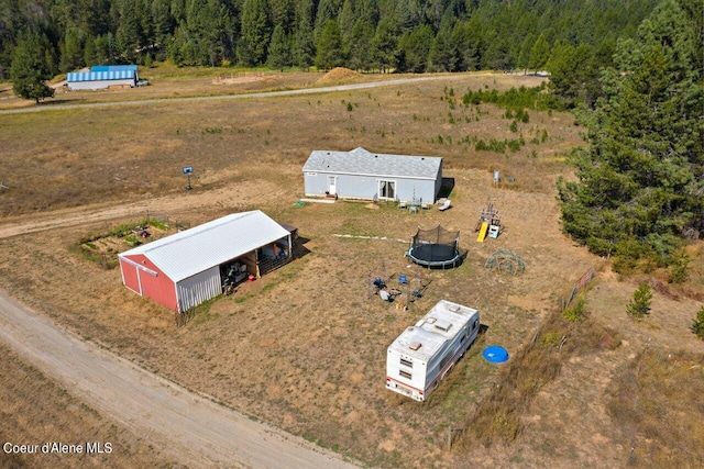 birds eye view of property with a forest view