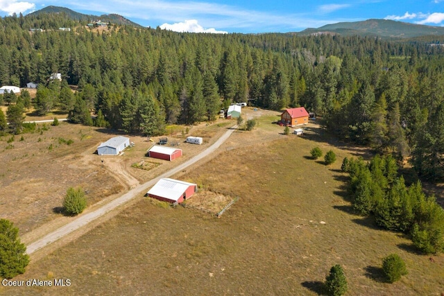 bird's eye view featuring a mountain view and a forest view