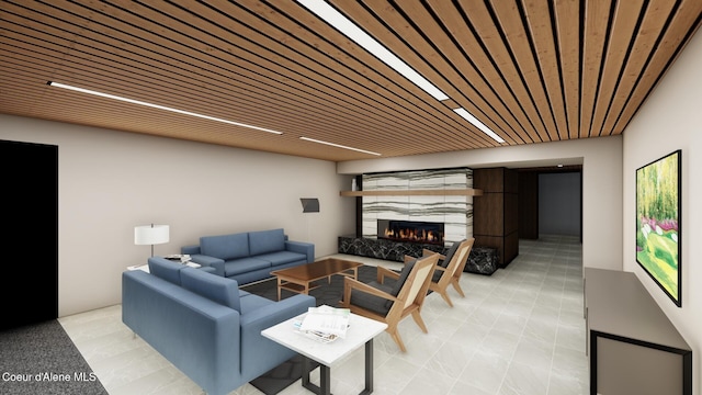 living room with wood ceiling and a high end fireplace