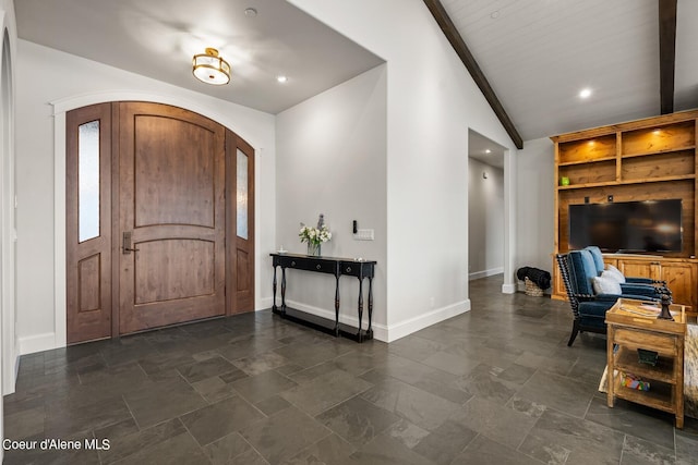 8491 N Mckinley Ln, Hayden, ID 83835 - foyer with vaulted ceiling, stone finish flooring, baseboards, arched walkways, and recessed lighting
