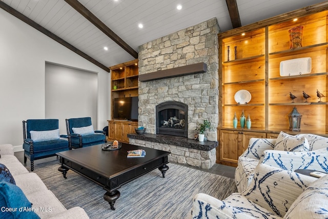 8491 N Mckinley Ln, Hayden, ID 83835 - living area featuring wooden ceiling, built in shelves, vaulted ceiling with beams, a stone fireplace, and recessed lighting