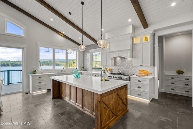 8491 N Mckinley Ln, Hayden, ID 83835 - kitchen with a sink, light countertops, and stone tile flooring