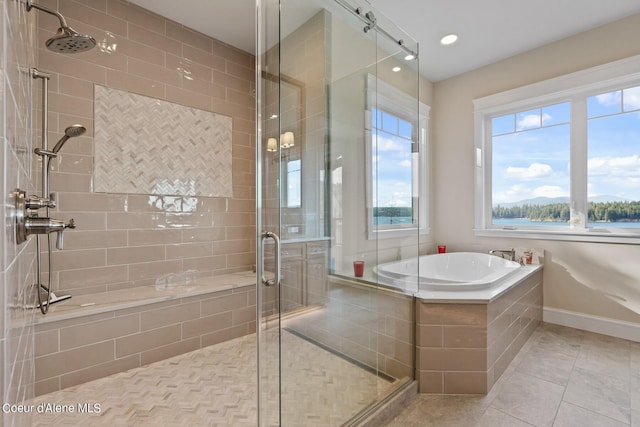8491 N Mckinley Ln, Hayden, ID 83835 - bathroom with a bath, baseboards, a stall shower, and tile patterned flooring