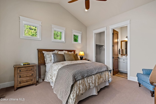 8491 N Mckinley Ln, Hayden, ID 83835 - carpeted bedroom featuring baseboards, connected bathroom, ceiling fan, lofted ceiling, and a spacious closet