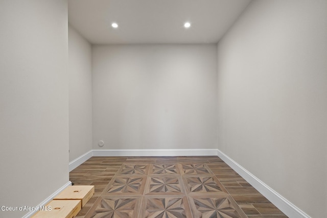 8491 N Mckinley Ln, Hayden, ID 83835 - empty room with parquet flooring, baseboards, and recessed lighting