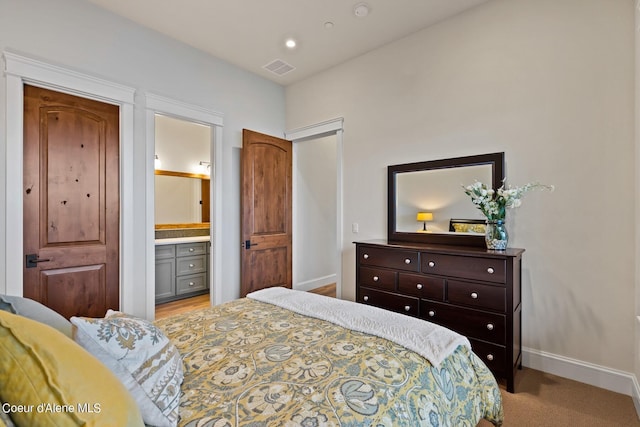 8491 N Mckinley Ln, Hayden, ID 83835 - bedroom featuring recessed lighting, ensuite bath, baseboards, and visible vents