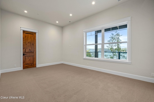 8491 N Mckinley Ln, Hayden, ID 83835 - carpeted empty room featuring baseboards and recessed lighting