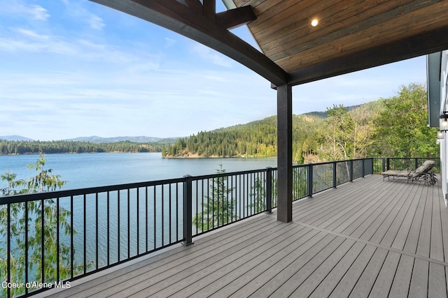 8491 N Mckinley Ln, Hayden, ID 83835 - deck featuring a wooded view and a water view