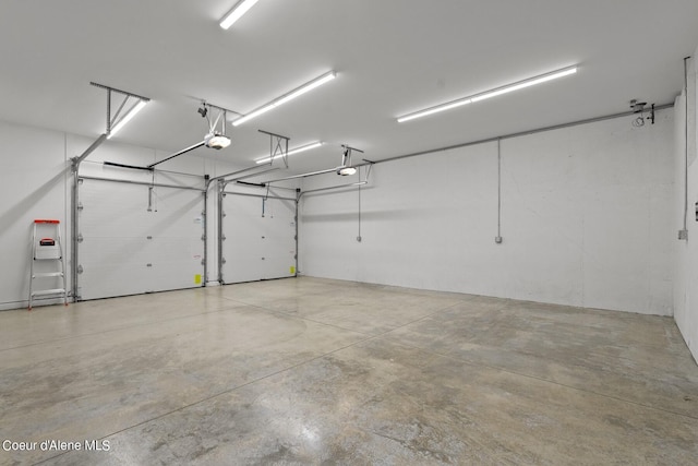 8491 N Mckinley Ln, Hayden, ID 83835 - garage featuring a garage door opener