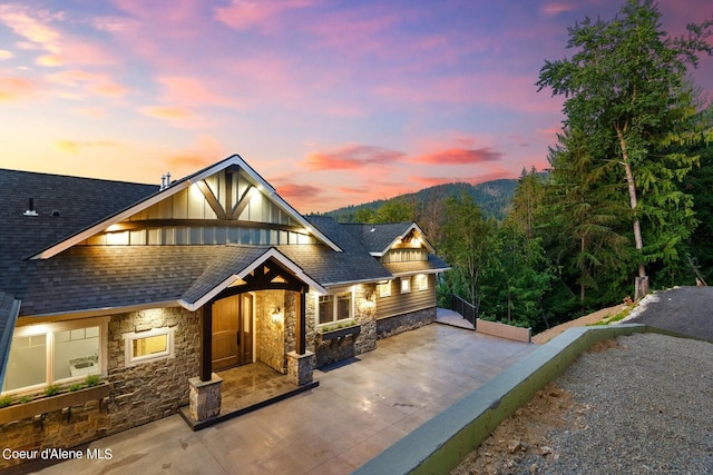 8491 N Mckinley Ln, Hayden, ID 83835 - view of front of property featuring stone siding and roof with shingles