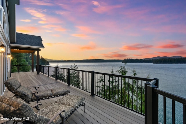 8491 N Mckinley Ln, Hayden, ID 83835 - deck at dusk featuring a water view