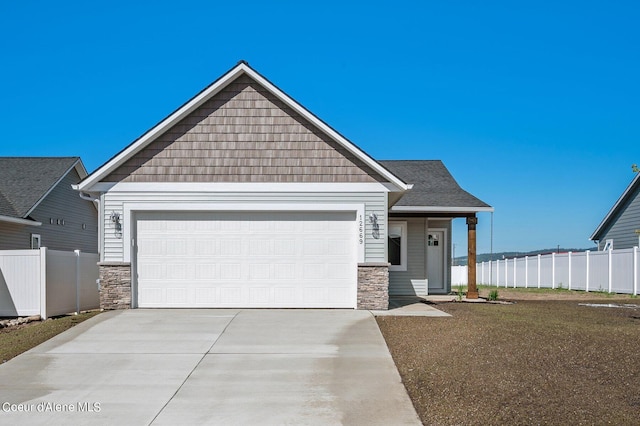 view of front facade featuring a garage and a front yard