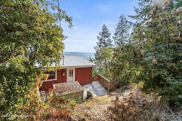 back of property with metal roof