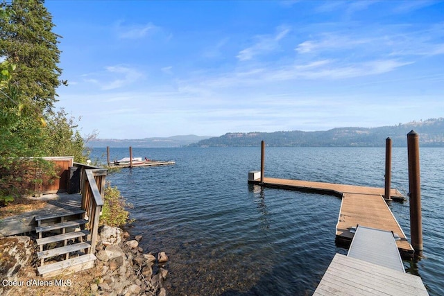 dock area featuring a water and mountain view