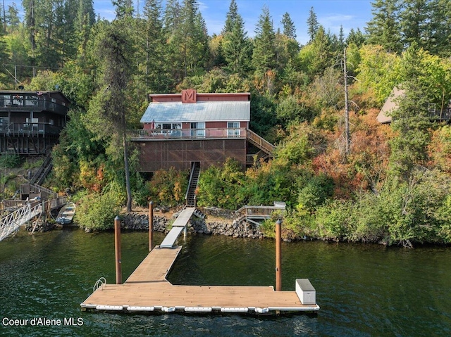 view of dock featuring a water view and stairway