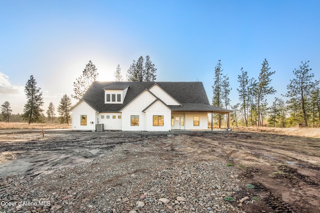 modern farmhouse style home with central AC unit