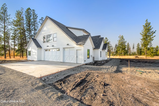 view of side of home featuring a garage