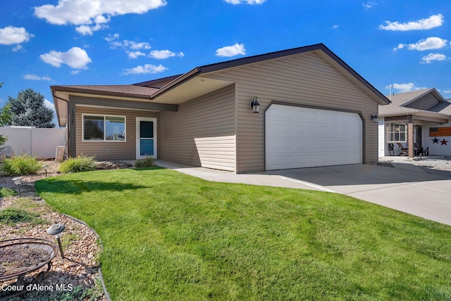 ranch-style home featuring a garage and a front lawn