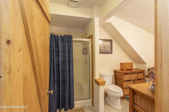 bathroom with toilet, vanity, and walk in shower