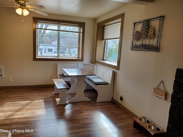 dining space with light hardwood / wood-style floors and ceiling fan