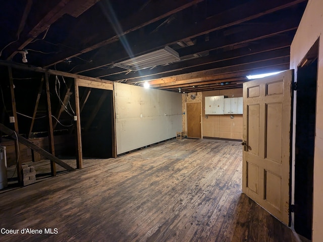 basement featuring wood-type flooring