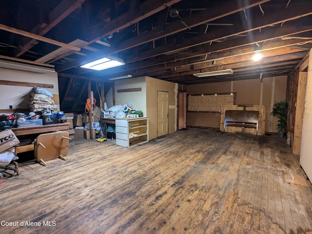 basement with hardwood / wood-style floors