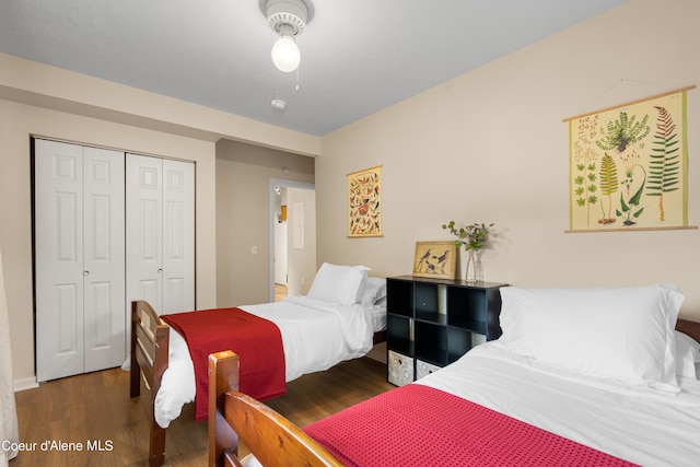 bedroom with ceiling fan, dark hardwood / wood-style flooring, and a closet