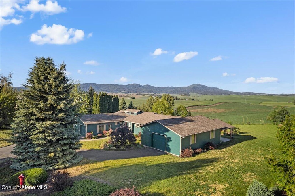 exterior space featuring a mountain view and a rural view