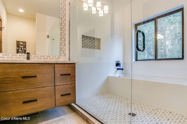 L3B10 N Walden Loop, Rathdrum, ID 83858 - bathroom featuring shower with separate bathtub, tile patterned flooring, and vanity