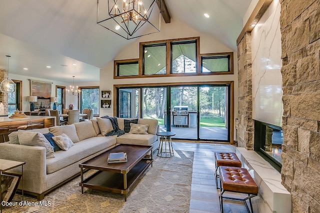 L3B10 N Walden Loop, Rathdrum, ID 83858 - living room featuring light wood-type flooring, high vaulted ceiling, beamed ceiling, and a notable chandelier