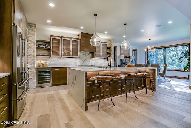 L3B10 N Walden Loop, Rathdrum, ID 83858 - kitchen with a kitchen breakfast bar, beverage cooler, light hardwood / wood-style flooring, and a large island