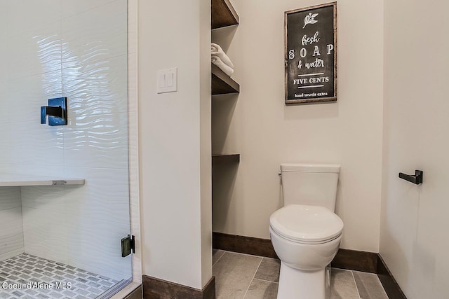 L3B10 N Walden Loop, Rathdrum, ID 83858 - bathroom with walk in shower, toilet, and tile patterned floors