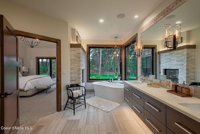 L3B10 N Walden Loop, Rathdrum, ID 83858 - bathroom with vanity, a fireplace, plenty of natural light, and a tub