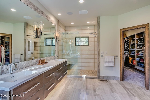 L3B10 N Walden Loop, Rathdrum, ID 83858 - bathroom featuring hardwood / wood-style flooring, a shower with door, and vanity