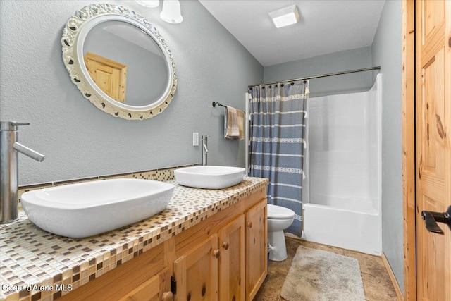 full bathroom featuring vanity, toilet, and shower / bath combo