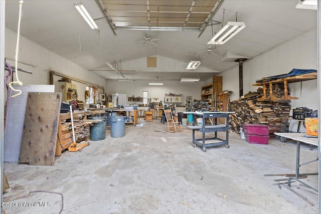 garage featuring a workshop area and ceiling fan