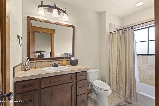 bathroom with tile patterned floors, toilet, vanity, and shower / bathtub combination with curtain