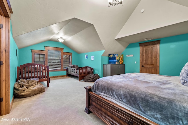 bedroom featuring lofted ceiling and carpet flooring