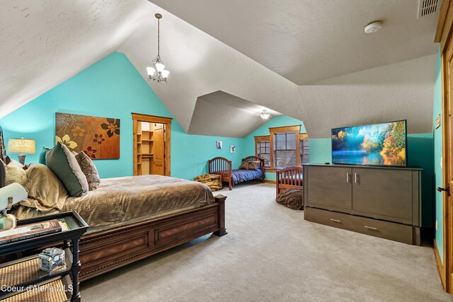 carpeted bedroom with lofted ceiling, visible vents, and a chandelier